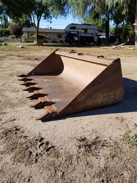 used skid steer tooth bucket